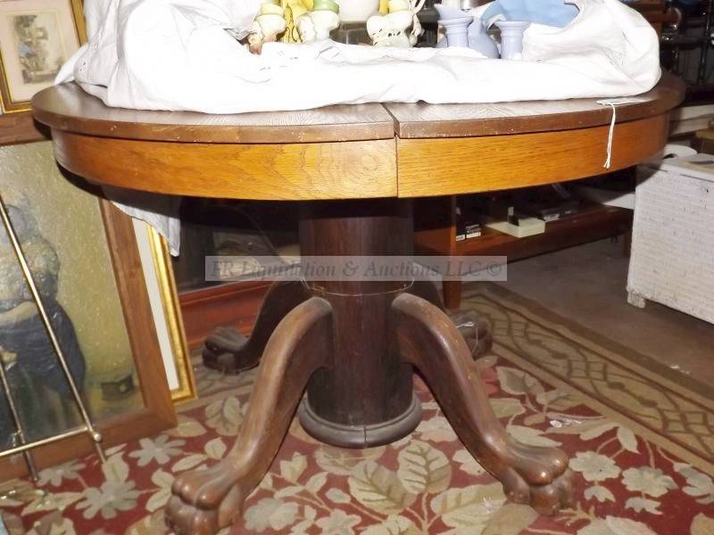 lot 603 image: Vintage solid oak claw foot round table