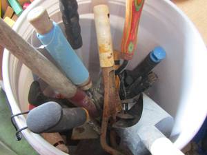lot 67 image: bucket of various yard tools