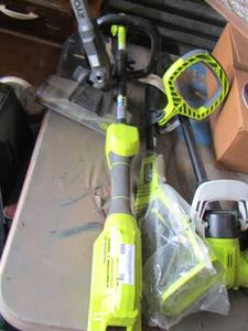 lot 70 image: various Ryobi weed eater vacuum pieces with 1 battery charger