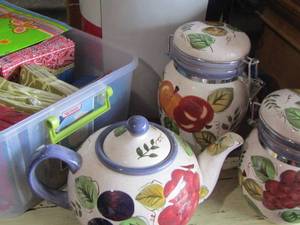 lot 59 image: Large lot of napkins new and some opened, -Oneida fruit tea pot- 2 canisters