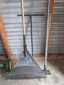 lot 100 image: T water shut off, 2 rakes