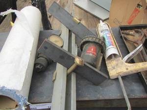 lot 103 image: grey 5 gallon bucket W  caulking gun, Stewart pump AND MORE 