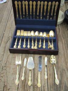 lot 9 image: International gold color silver ware set 12 forks,12 spoons, 12 knifes, 12 large spoons, 6 serving pieces