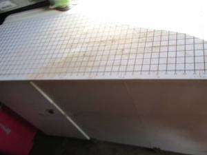 lot 171 image: fabric table on wheels 1 wheel is missing- 29x47x16 - side 16- 29x47x32