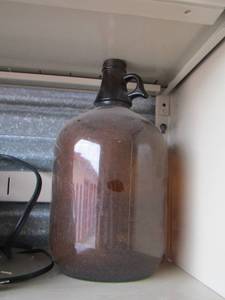 lot 36 image: Brown glass  jug