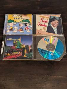 lot 186 image: 4 Retro Music CD Set Featuring Frank Sinatra, The Beatles, Elvis, The Tractors