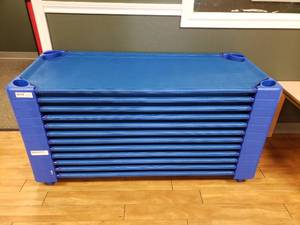 lot 34 image: Lot of 12 Sprogs Stackable Blue Daycare Cots
