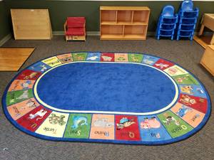 lot 48 image: Large Oval Classroom Rug.  78 x 109