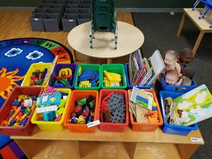 lot 66 image: Contents of Shelf.  12 Bins Full of Books, Babies, Puzzles, Toys, Games & Manipulatives