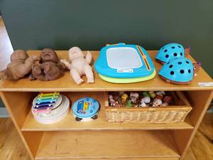 lot 116 image: Contents of Shelf.  Misc Babies, Musical Instruments, Little People & More