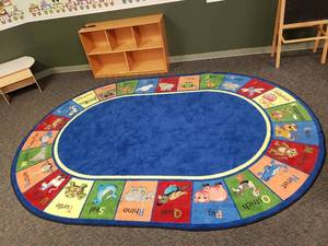 lot 194 image: Large Oval Classroom Rug.  78 x 109