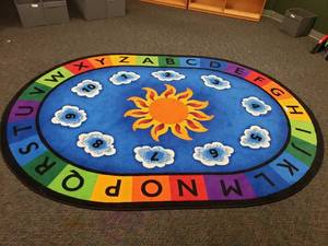 lot 223 image: Large Oval Classroom Rug.  69 x 95