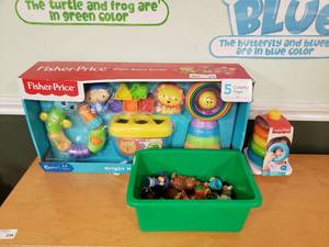 lot 233 image: Lot of Fisher Price Items.  Bright Basics Bundle, Little People & Stacking Toy.