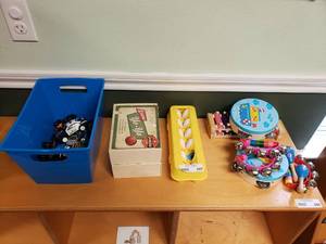lot 265 image: Lot of Misc Plat Items.  Yoyos, Diecast Cars, Musical Instruments & More