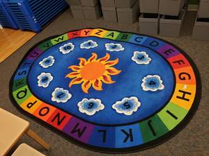 lot 268 image: Large Oval Classroom Rug.  69 x 95