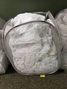 lot 278 image: Laundry Hamper FULL of Approx 35 Crib Mattress Covers