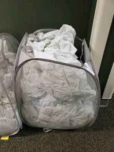 lot 279 image: Laundry Hamper FULL of Approx 35 Crib Mattress Covers