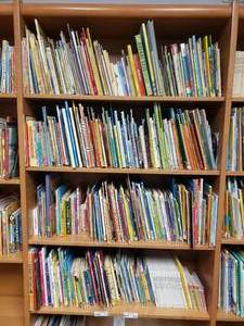 lot 313 image: Large Lot of Classroom Books.  Contents of 4 Shelves Pictured.