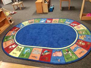 lot 357 image: Large Oval Classroom Rug.  78 x 109