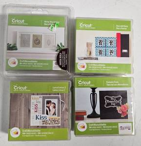 lot 23 image: LOT OF 4 CRICUT CARTRIDGES INCLUDING ONE UNOPENED AS SHOWN.