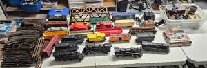 lot 81 image: LARGE VINTAGE MODEL TRAIN LOT INCLUDING LIONEL LOCOMOTIVES, PLENTY OF TRACKS, MIXED CARS, AND MORE AS SHOWN. TAKE A LOOK