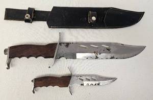 lot 54 image: Dual knife set with sheath as shown. 16.5 and 9.5 knives.