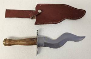 lot 55 image: Kris style blade knife with leather sheath as shown. Approx. 13 inches.