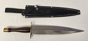 lot 63 image: Dagger style knife with leather sheath as shown. Approx. 18.5 inches.