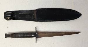 lot 74 image: Vintage 10 inch dagger with leather sheath as shown.