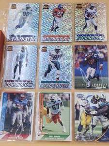 lot 64 image: Sleeve of football cards