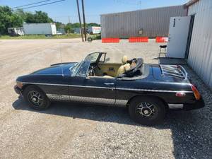 lot 1 image: 1980 MGB Limited Edition - Has Title - Runs - has new tires, battery, bearing, fuel pump and sending unit, new carpet, NOS roof, new brakes, new filters, new choke, new seat belts, carb has been rebuilt. Needs radio installed, brake light on