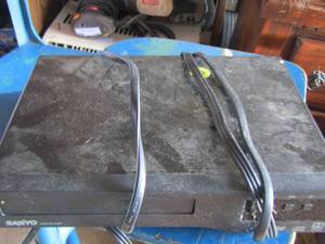 lot 61 image: Sanyo dvd player- gaming remotes and cords