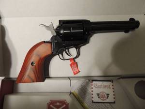 lot 121 image: Rough Rider Revolver  22 WNR  22LR  4 34 barrel, Heritage manufacture With  gun lock  NEW IN BOX