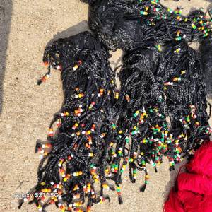 lot 89 image: Large variety of Halloween dress up wigs, most are new in packages  Misc.