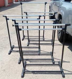 lot 64 image: Five Portable Adjustable Metal and Plastic Clothing Racks
