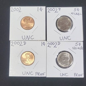 lot 246 image: Four 2002 Coins in Uncirculated Condition