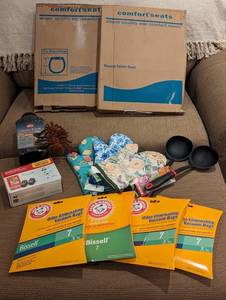 lot 133 image: NEW - 15 PC Mixed Lot w 2 Comfor Seats Round Toilet Seats, Ortho Snake B Gon, Oven Mitts, Ladels, Canon Ink Combo Pack, 4 Arm & Hammer Odor Eliminating Vacuum Bags, & More - QV DESCR
