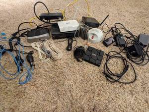 lot 113 image: Mixed Tech Lot w Zen Box, SMC Barricade SMCWBR14S-N4 Wireless Router, RF Modulator Video Converter, Direct TV Genie Mini Receiver, D-Link Wireless Router, Technicolor Modem Router, Etc. - QV DESCR