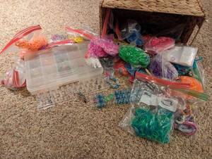 lot 93 image: Rubberband Jewelry Starter Kit w Storage Container, Loom, Basket, and Bags Full Of Assorted Rubberbands and Clips