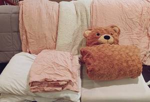 lot 112 image: King Bedding and Pillow Set w Grey Weighted Blanket, Pink Sheeets and Pillow Cases, 2 Standard Pillws, 1 Cervical Support Pillow, Offwhite Comforter Blanket, and Wearable Hooded Bear Blanket