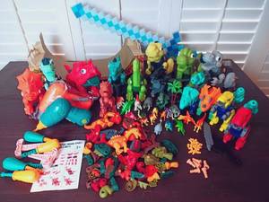 lot 78 image: Dino and Action Play Set w Over 20 STEM Reconstructable Dinosaurs, Drills and Screws, 15 Miniature Dinosaur Figures, Minecraft Sword, Fingerboard Skate Ramp, Etc.