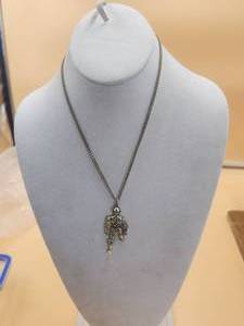 lot 49 image: C-3PO necklace - 1977-20th century Fox