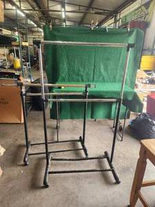 lot 47 image: Adjustable hanging clothes racks