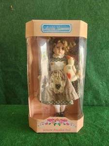 lot 55 image: Collectible Memories - genuine porcelain doll