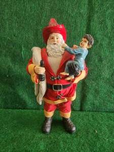 lot 82 image: Fireman Santa Clause figure