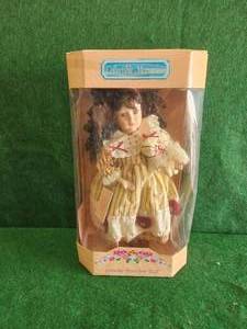 lot 94 image: Collectible Memories - genuine porcelain doll - limited edition
