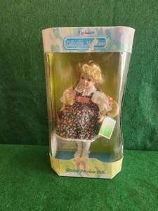 lot 150 image: Collectible Memories - genuine porcelain doll