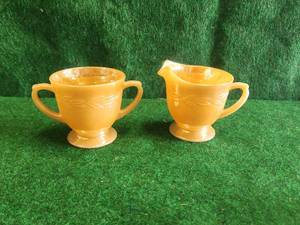 lot 157 image: Vintage Fire-King cream and sugar bowl set - peach lustre
