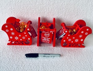lot 156 image: Lot Of 3 New With Tags - Nice European Chocolate Filled With Hazelnut Cream in Red Sleigh, 1.52Oz Each Sleigh - As Shown - Total Retail $21