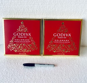 lot 159 image: Lot Of 2 - New Godiva Belgium 1926 9Pc Holiday Goldmark Assorted Chocolate, (3) Dark Chocolate Dome, (3) Mill Chocolate Hazelnut Heaven & (3) Milk Chocolate Almond Carmel, 18Pc Total, 3.8Oz Each Box - As Shown
